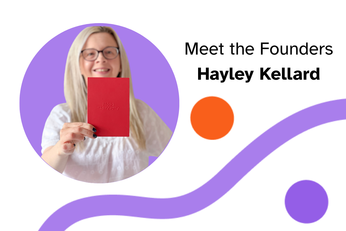 Hayley Kellard, founder of Dotty About Braille, holds up a red card which says Merry Christmas in Braille on the front